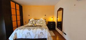 a bedroom with a bed and a dresser and a mirror at Wonderful Sea Views by Vapagó Tenerife in Costa Del Silencio +69 photos