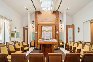 a conference room with chairs and a table in the middle at King david residence #102 Near Mamilla, luxurious in Jerusalem +39 photos