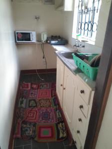Una cocina o kitchenette en Global Crib