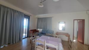 a hospital room with a bed and a window at Hercules Hills Sea View Villas in Kos