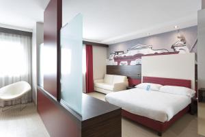 Postel nebo postele na pokoji v ubytování B&B Hotel Trento