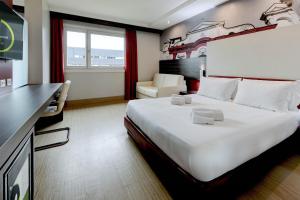 Postel nebo postele na pokoji v ubytování B&B Hotel Trento