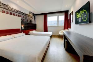 Postel nebo postele na pokoji v ubytování B&B Hotel Trento