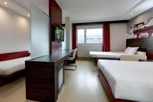Postel nebo postele na pokoji v ubytování B&B Hotel Trento