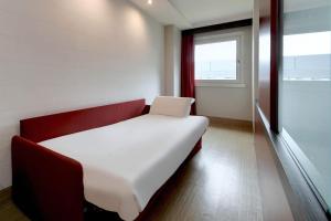 Postel nebo postele na pokoji v ubytování B&B Hotel Trento