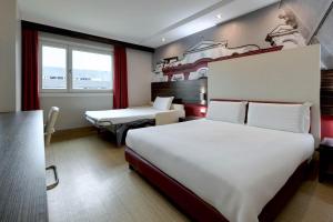 Postel nebo postele na pokoji v ubytování B&B Hotel Trento