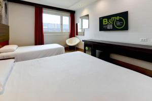 Postel nebo postele na pokoji v ubytování B&B Hotel Trento