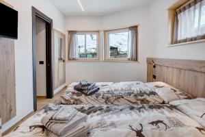 Postel nebo postele na pokoji v ubytování Chalet Kb