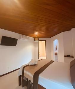 Postel nebo postele na pokoji v ubytování Torre Cajila Morro de São Paulo
