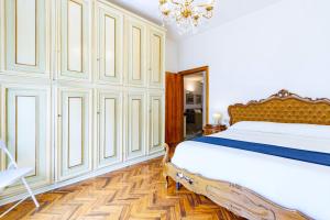 Ένα ή περισσότερα κρεβάτια σε δωμάτιο στο Appartamento D'Annunzio - MyHo Casa