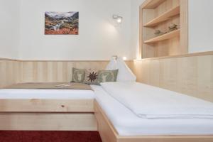 Łóżko lub łóżka w pokoju w obiekcie Gästehaus Herma