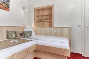 Łóżko lub łóżka w pokoju w obiekcie Gästehaus Herma