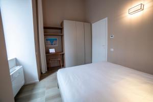 Ein Bett oder Betten in einem Zimmer der Unterkunft Be Mate Torino Centro