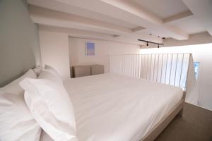 Ein Bett oder Betten in einem Zimmer der Unterkunft Be Mate Torino Centro
