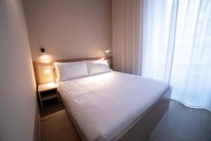 Ein Bett oder Betten in einem Zimmer der Unterkunft Be Mate Torino Centro