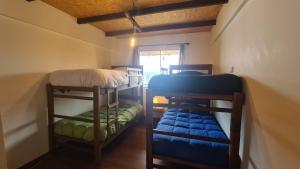 Postel nebo postele na pokoji v ubytování Cabañas Mirador Rakhem + 1 fotografie