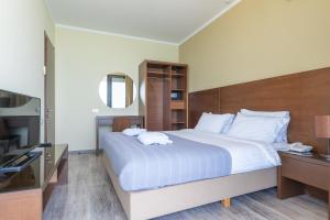 Postel nebo postele na pokoji v ubytování Gonio Inn