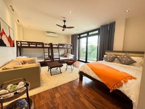 a bedroom with a bed and a bunk bed at Tahum Lake Resort in Los Baños +64 photos