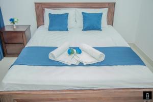 Ένα ή περισσότερα κρεβάτια σε δωμάτιο στο Fairway apartment 2BR Galle +23 φωτογραφίες