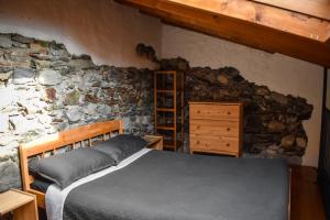 Posteľ alebo postele v izbe v ubytovaní Ciceri Properties Antonio Tacchini