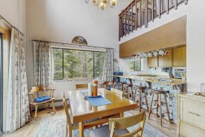 a kitchen and dining room with a table and chairs at The Garden Haus in Incline Village