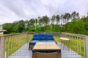 a patio with a table and chairs on a deck at Townhomes of Providence --- 9 John Hall Dr in Ocean View