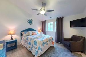 a bedroom with a bed and a ceiling fan at Townhomes of Providence --- 9 John Hall Dr in Ocean View