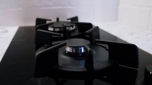 a stove top with two burners on top of it at A cosy apartment near the border in Narva