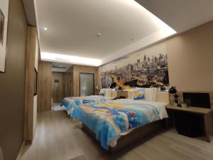 a hotel room with two beds and a painting on the wall at Atour Hotel Shanghai Lujiazui Babaiban in Shanghai