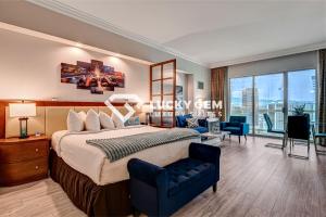 a bedroom with a king sized bed and a living room at Lucky Gem Penthouse & Luxury Suites at Signature Resort, Balcony Strip View 3505 in Las Vegas +63 photos