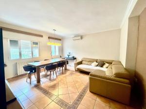 a living room with a couch and a table at Casa Claudia in Calpe