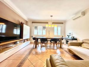 a living room with a table and a couch at Casa Claudia in Calpe