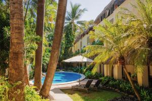 a resort with a swimming pool and palm trees at Casa Real Sayulita Hotel Boutique in Sayulita +29 photos