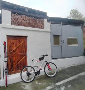 a bike parked in front of a white building at Nel Cuore della Via Francigena in Aosta
