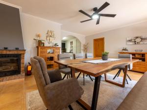 a dining room with a table and a fireplace at Holiday Home Villa Luz del Sol by Interhome in L'Ametlla de Mar