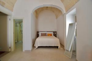 Ένα ή περισσότερα κρεβάτια σε δωμάτιο στο Dimore VitaMaria - Housea