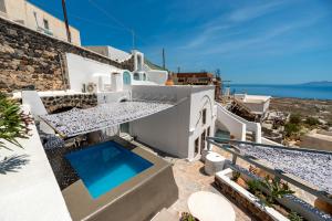 a view of a villa with a swimming pool at Blue Vine Villa - Private Pool - Panoramic Sea View in Kamari +28 photos