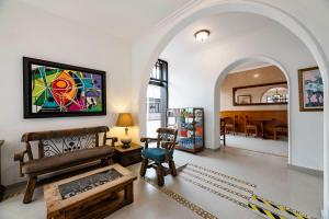 a living room with a couch and a table at Hotel El Campin in Bogotá