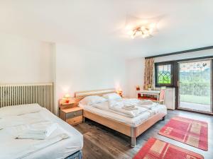 Postel nebo postele na pokoji v ubytování Holiday Home Zeitlos by Interhome