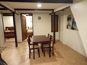 a dining room with a table and chairs at El Nido downtown apartment in El Nido