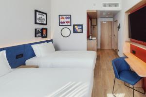 Postel nebo postele na pokoji v ubytování Hampton By Hilton Venice Isola Nuova