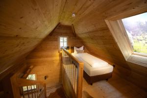 Postel nebo postele na pokoji v ubytování Schwarzwald Chalet -Wilde Rench-