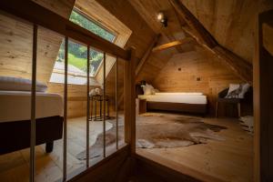 Postel nebo postele na pokoji v ubytování Schwarzwald Chalet -Wilde Rench-