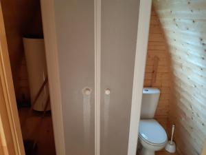a bathroom with a toilet in a room at Camping Onlycamp Port Sainte Marie in Malicorne-sur-Sarthe +52 photos