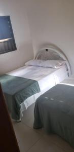 a bedroom with two beds in a room at Sítio Chã do Cajá in Sao Benedito do Sul
