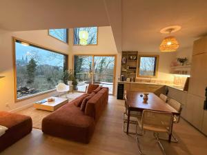 a living room with a couch and a table at Le Spot - Bain Nordique – Vue Cathédrale in Chartres