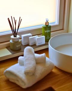 a white towel sitting on a table next to a sink at Estate Cabins at Ballygarry in Tralee