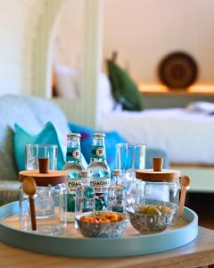 a tray with bottles and bowls of food on a table at Estate Cabins at Ballygarry in Tralee +14 photos