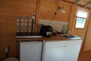 a kitchen with a counter top and a sink at Finca la montaña roja in Almogía