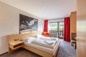 Postel nebo postele na pokoji v ubytování keyone rooms Loisach